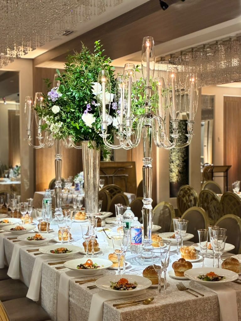 Candlelit long table under warm decor lighting